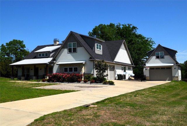 view of front facade featuring roof with shingles, driveway, a garage, and a front lawn