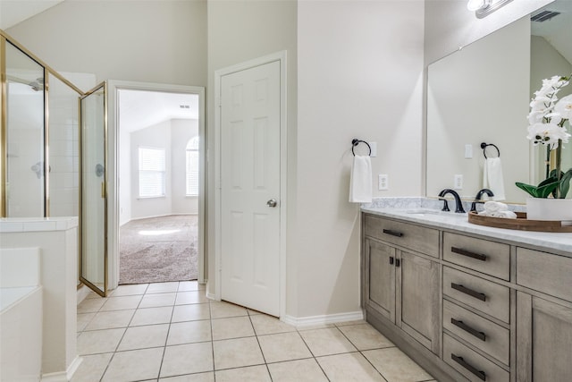 full bath with a shower stall, tile patterned flooring, vanity, and visible vents
