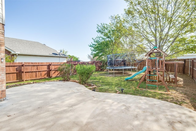 view of patio with a trampoline, a fenced backyard, and a playground