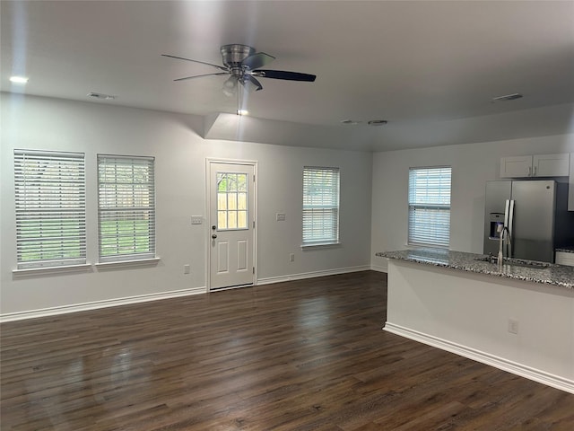 1985 W Bond St, Denison, TX 75020 - foyer entrance featuring visible vents, baseboards, a ceiling fan, and dark wood-style floors