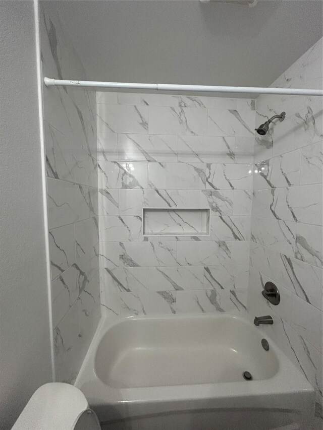 1985 W Bond St, Denison, TX 75020 - bathroom with toilet and shower / washtub combination
