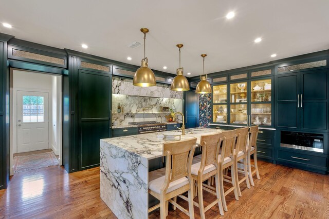 860 Prairie Trl, Argyle, TX 76226 - bar with recessed lighting, light wood finished floors, backsplash, visible vents, and pendant lighting