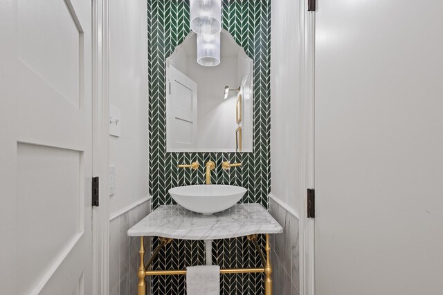 860 Prairie Trl, Argyle, TX 76226 - bathroom with tile walls, a wainscoted wall, and a sink