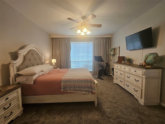 bedroom featuring dark colored carpet and ceiling fan