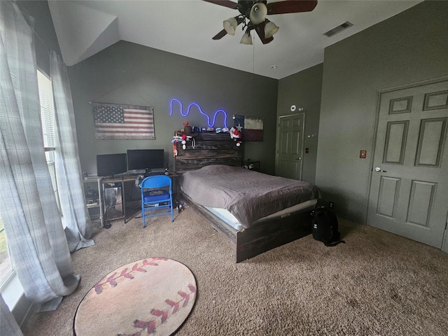 bedroom with visible vents, a ceiling fan, carpet flooring, and vaulted ceiling