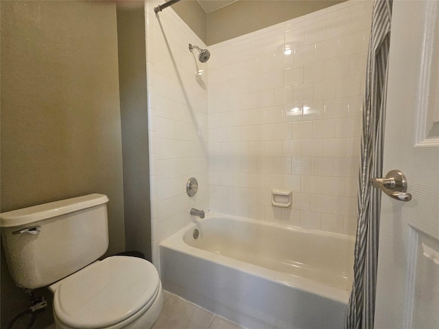 bathroom featuring toilet and shower / tub combo with curtain