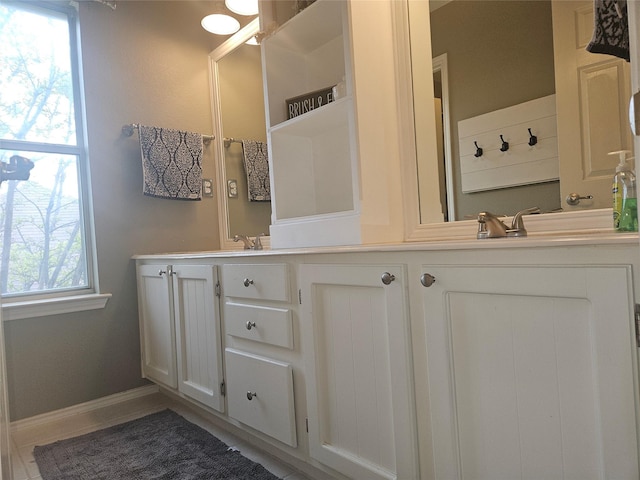 bathroom featuring tile patterned floors and vanity