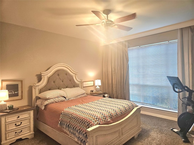 bedroom featuring dark colored carpet and ceiling fan