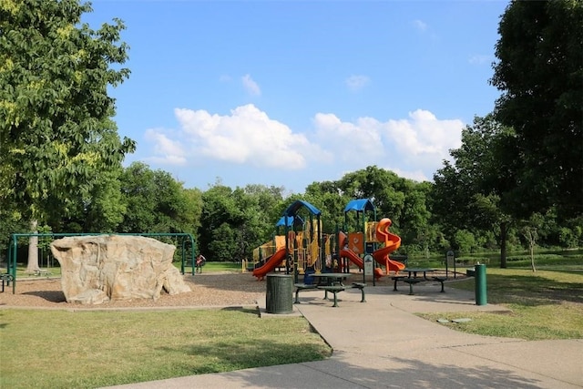 community jungle gym with a yard