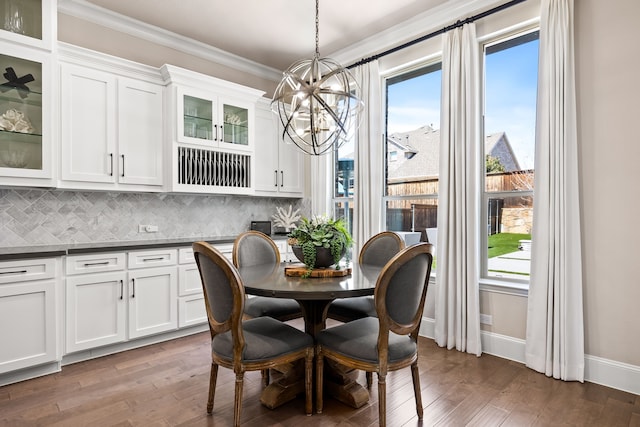 dining space featuring plenty of natural light, a chandelier, and hardwood / wood-style floors