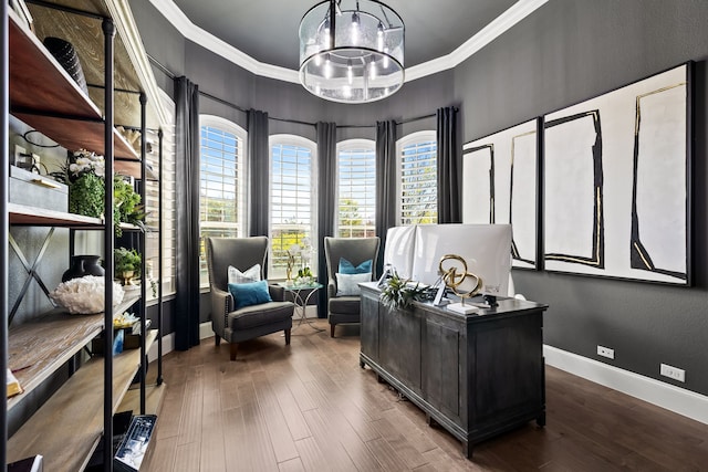 office space with ornamental molding, baseboards, an inviting chandelier, and wood finished floors