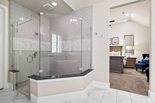 bathroom with a stall shower, marble finish floor, baseboards, and visible vents