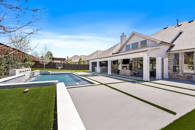 view of pool with a patio area, outdoor lounge area, a lawn, a fenced backyard, and a fenced in pool