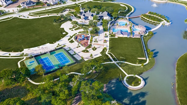 drone / aerial view featuring a water view and a residential view