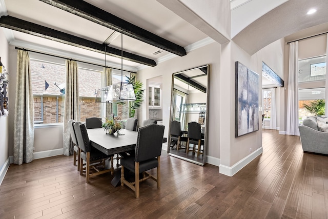 dining room with visible vents, baseboards, dark wood finished floors, and beam ceiling