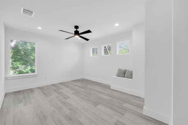 unfurnished room with recessed lighting, visible vents, and light wood-type flooring