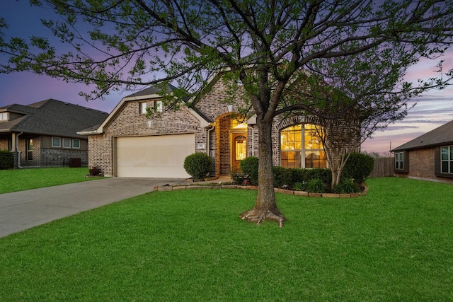 4901 Camp Verde Cir, Sherman, TX 75092 - view of front of house featuring brick siding, driveway, a garage, a yard, and central AC