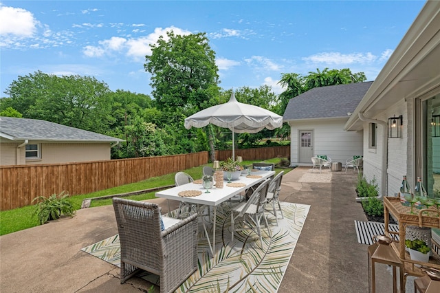 4209 Westmont Ct, Fort Worth, TX 76109 - fenced backyard featuring outdoor dining space and a patio