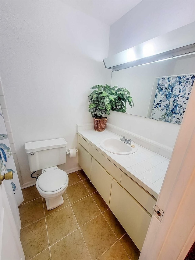 3205 Parkside Dr, Mesquite, TX 75150 - full bath with toilet, vanity, tile patterned floors, and baseboards