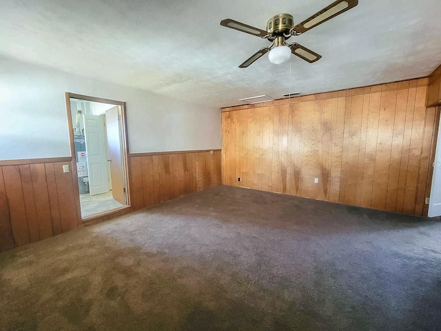 3205 Parkside Dr, Mesquite, TX 75150 - unfurnished room with wooden walls, a wainscoted wall, carpet flooring, and ceiling fan