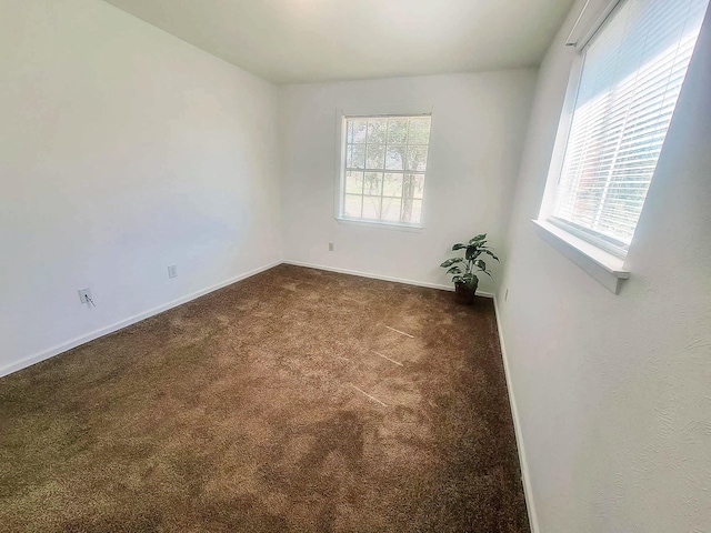 3205 Parkside Dr, Mesquite, TX 75150 - empty room featuring dark carpet and baseboards