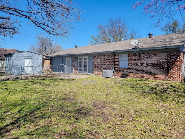 3205 Parkside Dr, Mesquite, TX 75150 - rear view of property with french doors, brick siding, central AC unit, and a patio