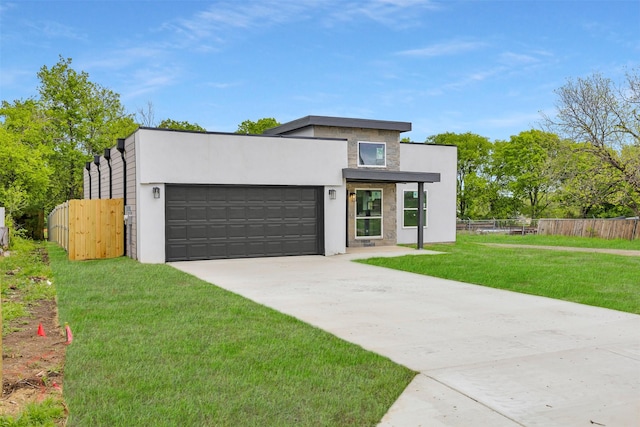 206 E Gilmer St, Rice, TX 75155 - modern home with a garage, driveway, and stucco siding