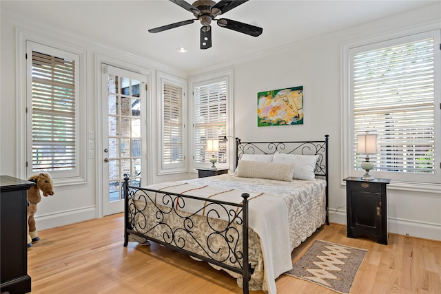 bedroom with baseboards, ornamental molding, ceiling fan, light wood finished floors, and access to outside