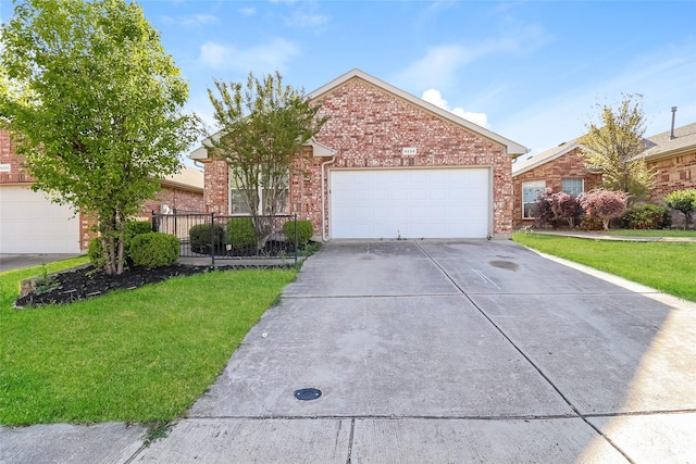 6228 Adonia Dr, Fort Worth, TX 76131 - view of front facade with concrete driveway, brick siding, an attached garage, and a front lawn