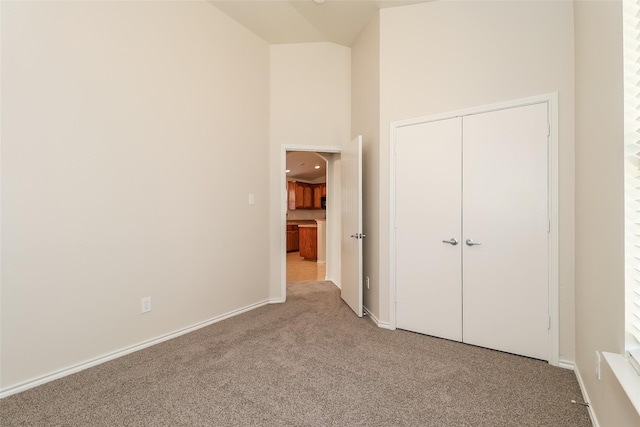 6228 Adonia Dr, Fort Worth, TX 76131 - unfurnished bedroom with a high ceiling, a closet, baseboards, and carpet floors