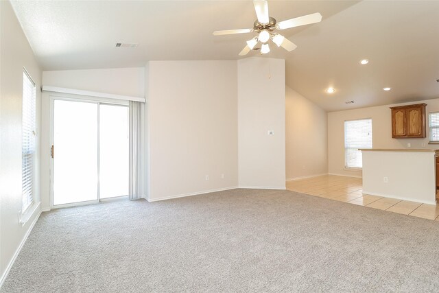 6228 Adonia Dr, Fort Worth, TX 76131 - unfurnished living room featuring light carpet, light tile patterned floors, vaulted ceiling, and recessed lighting