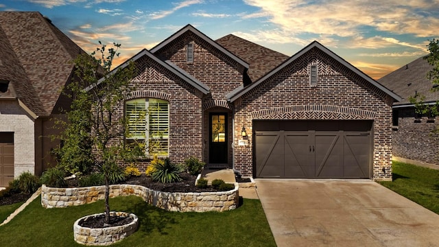 1920 Barnhill Ln, Van Alstyne, TX 75495 - view of front of property featuring brick siding, driveway, a yard, and an attached garage