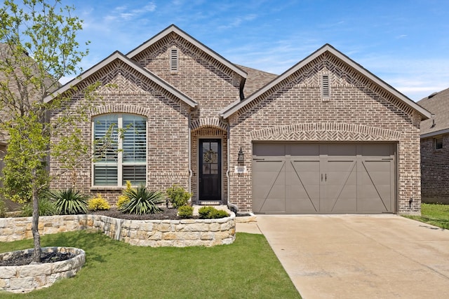 1920 Barnhill Ln, Van Alstyne, TX 75495 - french provincial home with brick siding, concrete driveway, a garage, and a front yard
