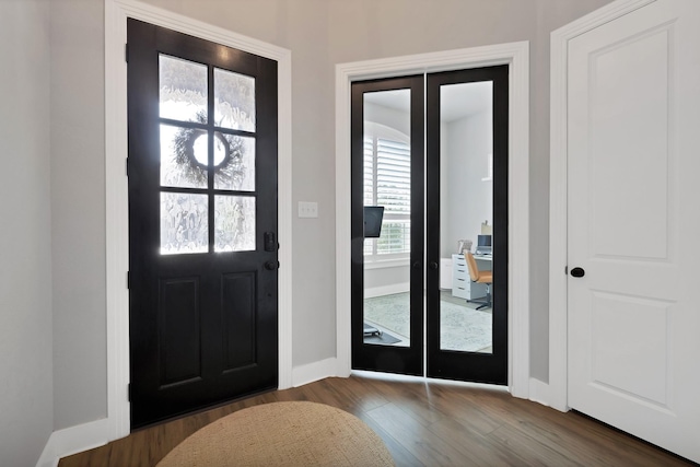 1920 Barnhill Ln, Van Alstyne, TX 75495 - foyer with french doors, wood finished floors, and baseboards