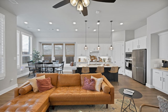 1920 Barnhill Ln, Van Alstyne, TX 75495 - living room featuring ceiling fan, wood finished floors, baseboards, and recessed lighting