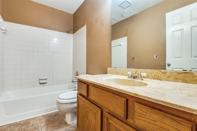 bathroom with toilet, vanity, tile patterned flooring, and shower / bath combination