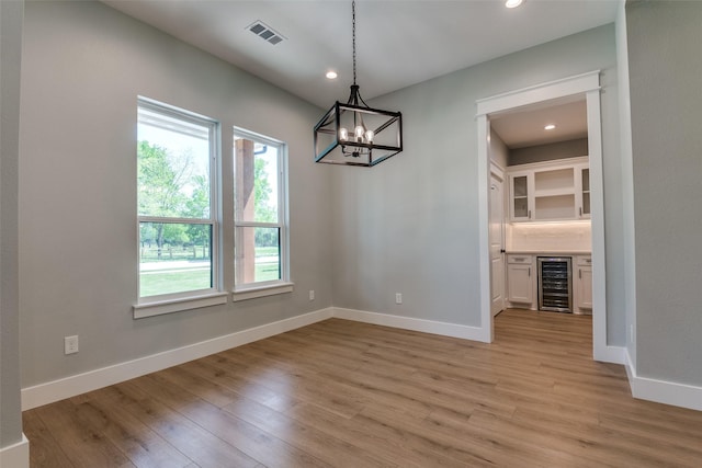 3822 Evergreen Ln, Caddo Mills, TX 75135 - unfurnished dining area with light wood finished floors, recessed lighting, a dry bar, wine cooler, and baseboards