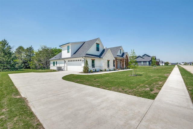 3822 Evergreen Ln, Caddo Mills, TX 75135 - modern farmhouse featuring driveway, board and batten siding, a front lawn, and a garage