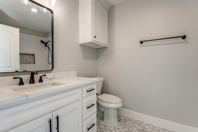 3822 Evergreen Ln, Caddo Mills, TX 75135 - full bathroom featuring toilet, a tile shower, vanity, and baseboards