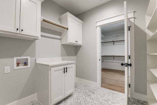 3822 Evergreen Ln, Caddo Mills, TX 75135 - laundry area with cabinet space, baseboards, and hookup for a washing machine