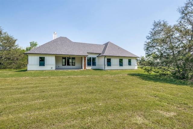 3822 Evergreen Ln, Caddo Mills, TX 75135 - back of house with a yard, roof with shingles, and a chimney