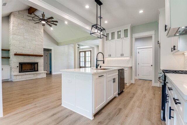 3822 Evergreen Ln, Caddo Mills, TX 75135 - kitchen with a sink, open floor plan, appliances with stainless steel finishes, a kitchen island with sink, and light wood-style floors