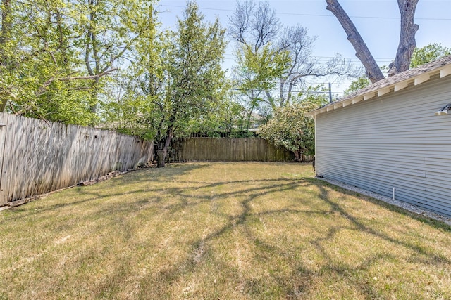 view of yard with a fenced backyard
