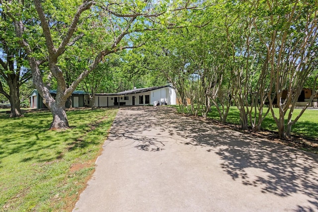 336 Kirk Ave, Pottsboro, TX 75076 - ranch-style house featuring concrete driveway and a front yard