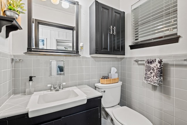 336 Kirk Ave, Pottsboro, TX 75076 - half bath with tile walls, toilet, vanity, and wainscoting