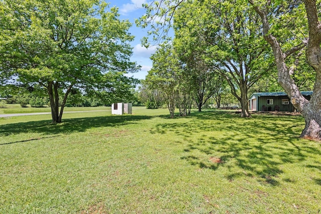 336 Kirk Ave, Pottsboro, TX 75076 - view of yard featuring an outdoor structure and a shed