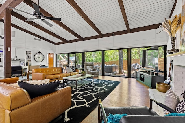 336 Kirk Ave, Pottsboro, TX 75076 - living room with high vaulted ceiling, a ceiling fan, wood finished floors, a healthy amount of sunlight, and beam ceiling