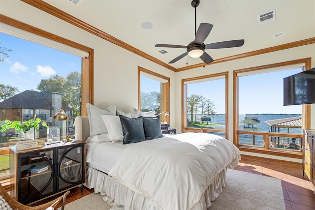 bedroom featuring visible vents, multiple windows, and crown molding
