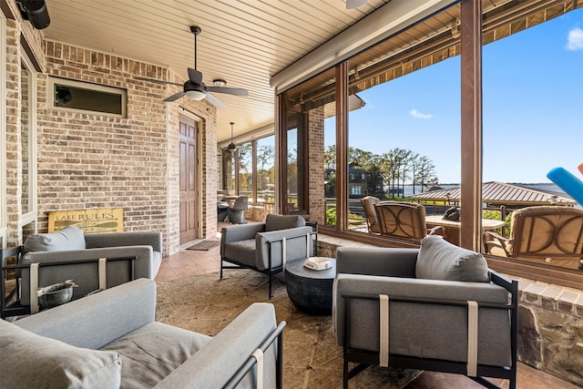view of patio featuring an outdoor living space and a ceiling fan