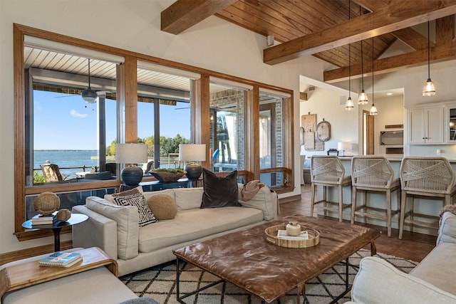 living room featuring wood ceiling, vaulted ceiling with beams, and a water view